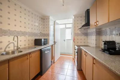 a kitchen with a sink and a counter top at Casa Verde by Olala Homes in Porto