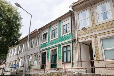 an old building with a green and white facade at Casa Verde by Olala Homes in Porto