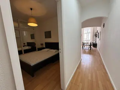 a view of a bedroom with a bed and a hallway at Oporto Good Vibrations -Downtown in Porto