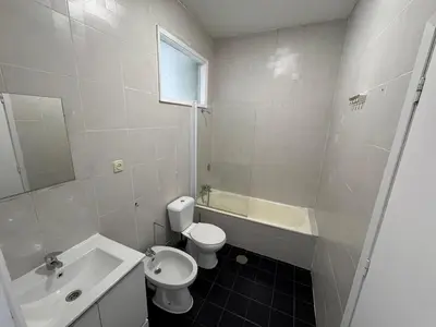 a white bathroom with a toilet and a sink at Oporto Good Vibrations -Downtown in Porto
