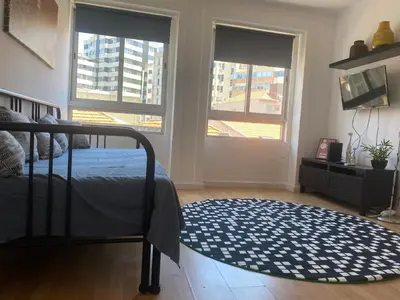 a bedroom with a bed and a rug on the floor at Oporto Perfect Days - Downtown in Porto