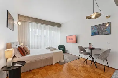 a bedroom with a bed and a table and chairs at GuestReady – A welcoming space to unwind in Porto