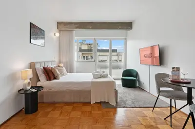 a bedroom with a bed and a table and chairs at GuestReady – A welcoming space to unwind in Porto