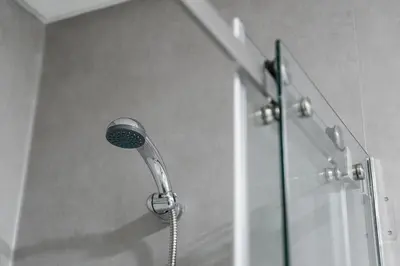 a shower with a shower head in a bathroom at Panorama Apartments Santa Catharina Porto in Porto