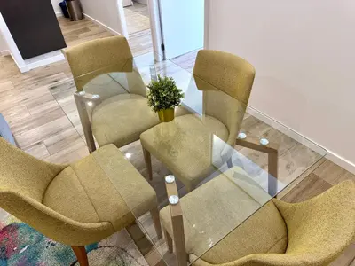 three chairs and a table with a vase on it at Sounds of Porto 424 - Bolhão & Tradition in Porto