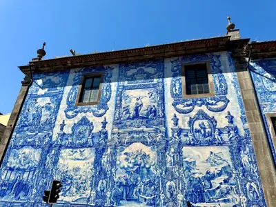 a blue and white building with paintings on it at Sounds of Porto 424 - Bolhão & Tradition in Porto