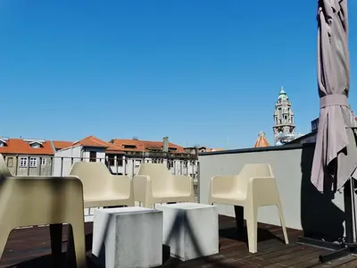 a bathroom with a white sink and a shower at Casas do Rivoli in Porto