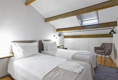a white living room with a white couch at Casas do Rivoli in Porto