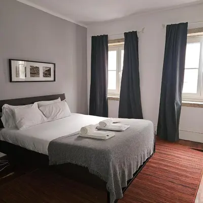 a bedroom with a bed with two towels on it at Monte Lapa 38 in Porto