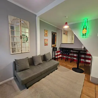 a living room with a couch and a table at Monte Lapa 38 in Porto