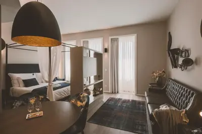 a living room with a couch and a table and a bed at Viterbo'8 - Bonjardim Apartments in Porto