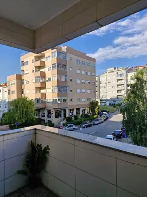 a balcony with a view of a street and buildings at Oliveira Charm-Porto in Porto
