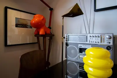 a room with a radio with a stuffed animal sitting next to it at Caligrafia - Artistic Studio in Porto