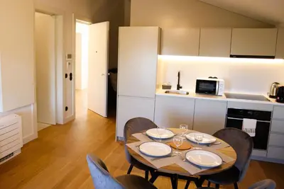a kitchen with a table and chairs in a room at Fernandes Tomás Apartments 797 in Porto