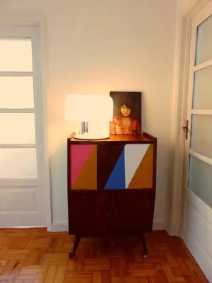 a colorful dresser in a room with a lamp at Aida's Haven - Bolhão in Porto