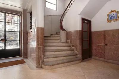 a staircase in a building with a stair case at Aida's Haven - Bolhão in Porto