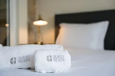 a bed with two towels on top of it at GuestReady - Relaxing Porto stay in Porto
