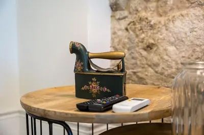 a telephone sitting on a table with a remote control at GuestReady - Relaxing Porto stay in Porto
