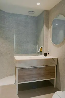 a bathroom with a sink and a mirror at ORM - Santa Teresa Apartments in Porto