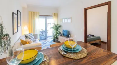 a living room with a table with yellow bowls on it at Adorable apartment center Nao in Porto