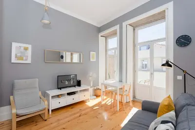 a picture of a city on a wall with a light at Liiiving in Porto - Silver Light Apartment in Porto