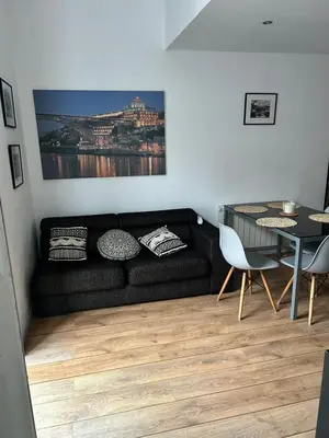 a dining room with a table with glasses and silverware at Ribeira Dreams in Porto