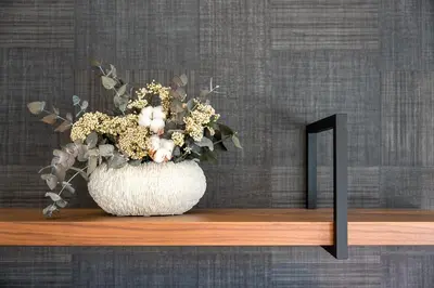 a vase of flowers on a shelf with a mirror at GuestReady - Stylish base steps from attractions in Porto