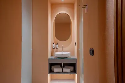 a bathroom with a sink and a mirror at Akeah Porto Centro in Porto