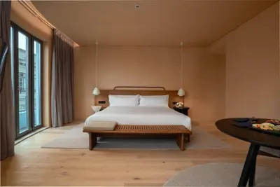 a bedroom with a bed and a table at Akeah Porto Centro in Porto