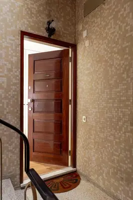 a wooden door in a corner of a room at Central & Stylish Apartment by HostWise in Porto