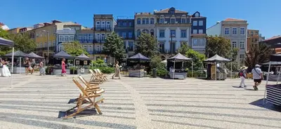 a group of people walking down a street at Carmo House - Art and Creativity in Downtown Porto in Porto