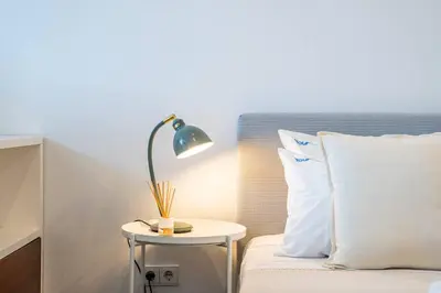 a bedroom with a bed with towels on it at Carmo House - Art and Creativity in Downtown Porto in Porto