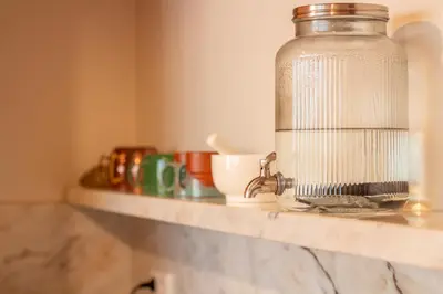 a kitchen counter with a glass jar on a counter top at Chic Campanhã Home w Free Parking by LovelyStay in Porto