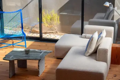 a living room with a couch and a table and a chair at Chic Campanhã Home w Free Parking by LovelyStay in Porto