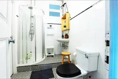 a bathroom with a shower and a toilet and a sink at Love&Life - Cosy&Central in Porto