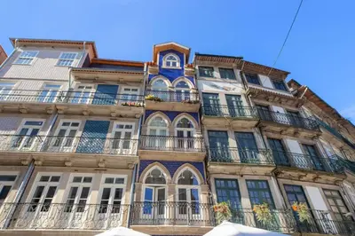 a tall building with balconies on the side of it at Luxury Apartment In Cardosas in Porto