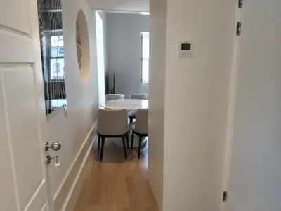 a hallway leading into a dining room with a table at Timeless Elegance Boutique for two in Porto