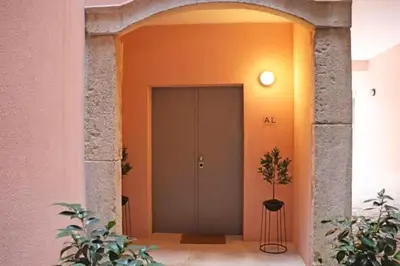 an entrance to a building with a door and a plant at Formosa IN in Porto