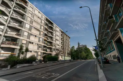 an empty street in front of a building at O Navegador in Porto