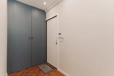 a room with white walls and a door at Fernão de Magalhães in Porto