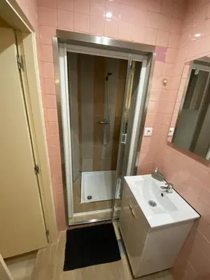 a bathroom with a white sink and a shower at Family&Friends 1 - cosy&central in Porto