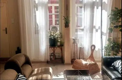 a living room with a couch and a chair at Family&Friends 1 - cosy&central in Porto