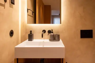a bathroom with a white sink and a mirror at Verde Almada 3d by LovelyStay in Porto