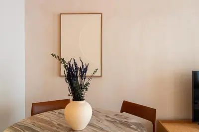 a white vase sitting on top of a table at Verde Almada 3d by LovelyStay in Porto