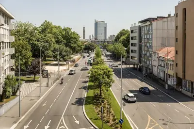 a view of a city street from a balcony at Apartamento de luxo Centro do Porto - ACE Residence in Porto