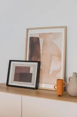 a framed picture sitting on a shelf with a coffee mug at Porto Stay no Marques with AC and parking place in Porto