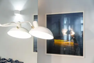 a pair of lights on a wall with a picture at GuestReady - Tempting getaway in Porto in Porto