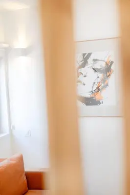 a bedroom with a bed with white sheets and pillows at Clérigos Loft | 111 Collection in Porto