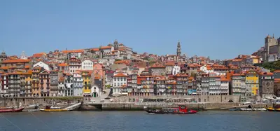 a large city with buildings and boats in the water at Quinta de Sao Marcos Suite Deluxe in Vila Nova de Gaia