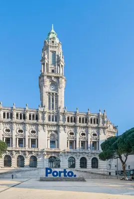 a building with a clock tower in front of it at Quinta de Sao Marcos Suite Deluxe in Vila Nova de Gaia